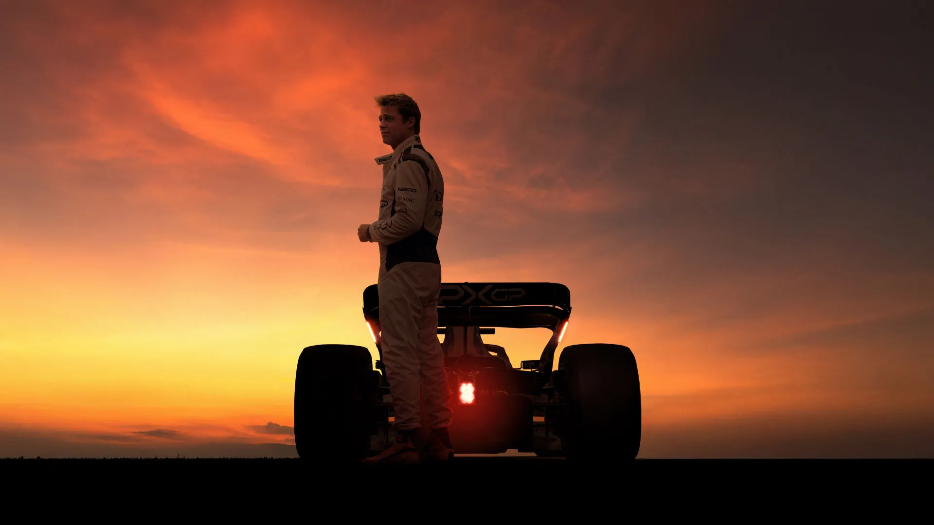F1 movie dramatic sunset silhouette showcasing speed and precision across networks